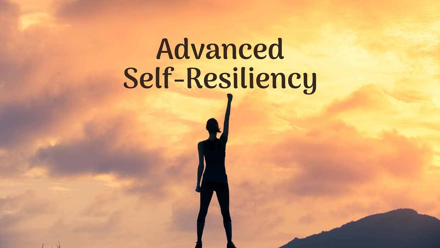 person with self-resiliency at the top of a mountain